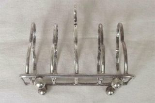 A ANTIQUE SOLID STERLING SILVER SHAPED TOAST RACK BIRMINGHAM 1912. 7