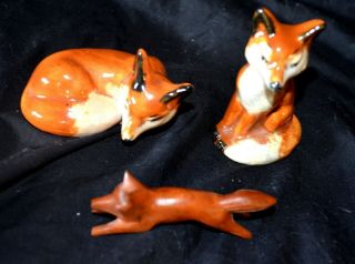 Vintage 2 Porcelain Red Foxes Figurines Pair,  1 Laying Down 1 Sitting,  1 Wood
