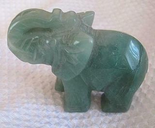 3.  0” Natural Green Jade Hand Carved Elephant Trunk Raised Detailed