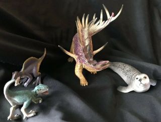 Schleich Kentrosaurus,  Velociraptor,  Spinosaurus Dinosaurs,  Seal - Set Of 4 2
