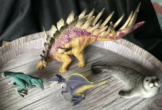 Schleich Kentrosaurus,  Velociraptor,  Spinosaurus Dinosaurs,  Seal - Set Of 4 4