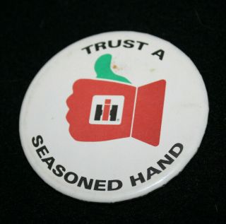 Unique Vintage International Harvester " Trust A Seasoned Ih Hand " Pin