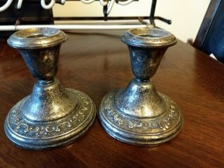 Two pairs of weighted sterling candle holders 5