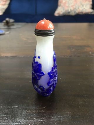 Chinese snuff bottle in white glass with deeply carved blue overlay of fish 5