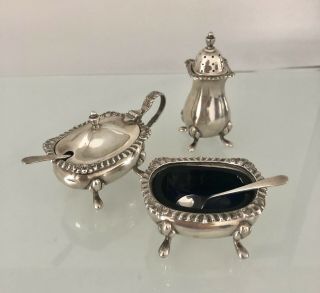 A Silver Cruet Set With Blue Liners & Spoons