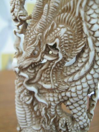 Finely Carved Buffalo Bone Statue Of A Chinese Dragon Fighting A Pheonix