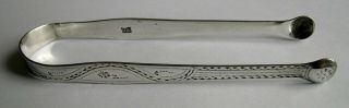 Hester Bateman: A George III silver sugar tongs,  INCUSE DUTY MARK 1784 - 6 2