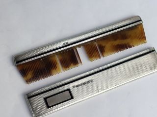 An Art Deco Silver and Black Enamel Cased Comb,  1937 8