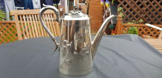 An Antique Silver Plated Tea Pot With Respoused Patterns By James Deakin & Sons.