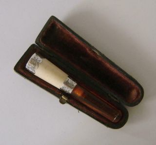 A Sterling Silver Mounted Cigarette Holder With Amber Mouthpiece Chester 1895