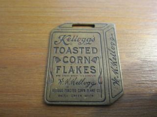 Interesting & Collectible Kelloggs Corn Flakes Metal,  Wach Fob?