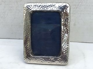 An Antique Hammered Silver Photograph Frame,  1910