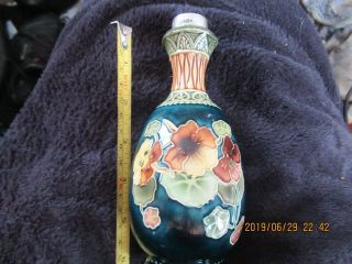 A Pottery Bottle/ Vase Nicely Decorated With A Solid Silver Top