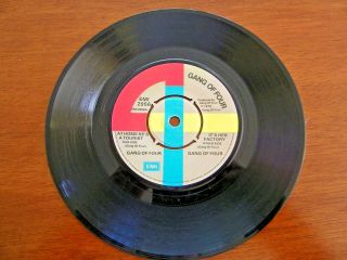 GANG OF FOUR AT HOME HE ' S A TOURIST B/W IT ' S HER FACTORY 1979 UK IMPORT 45 RPM 4