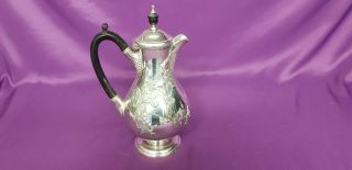 An Antique Silver Plated Tea Pot With Respoused Patterns By J.  Dixon & Sons.