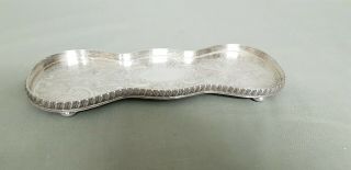 A Antique Silver Plated Tray With Engraved Patterns.