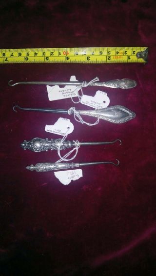 Four Small Silver Button Hooks