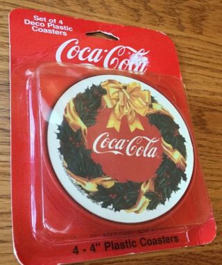 1997 Coca Cola Plastic Coasters Set Iof 4 With Wreath & Gold Ribbon
