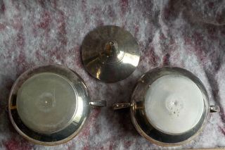 Silver colored creamer and sugar with lid,  unmarked 3
