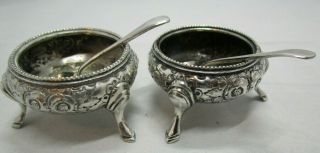Two Vintage Silver Plated Salt Cellars On Tripod Legs,  With Spoons.