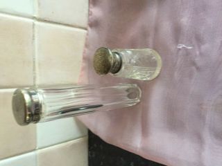 cut glass perfume bottle with a hallmarked silver top,  1 other vanity bottle 3