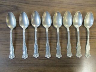 Eight Vintage Fancy Rogers Nickel Silver Spoons