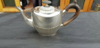 An Antique Silver Plated Bachelor Tea Pot With Semi Fluted Pattern.  Ornate.