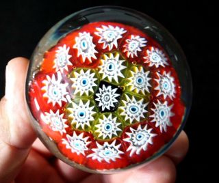 A Vintage Art Glass Paperweight With Millefiori In Red Yellow And Blue