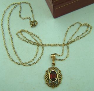 A Vintage 9ct Gold Red Garnet Set Pendant Of Dainty Size.