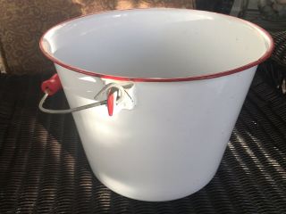 Vintage white Enamel Ware bucket w/red rim and handle (m) 2
