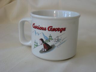 Curious George Sledding Down Snow Christmas Winter Scene Mug Universal Studios