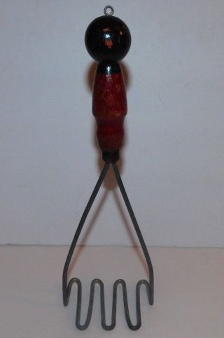 Neat Vintage Red And Black Wooden Handle Potato Masher