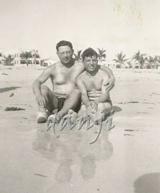 Swimsuit Men Sit On The Beach With A Side Hug And Feet In The Camera Old Photo