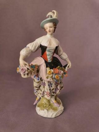 18th Century Bow Or Chelsea Porcelain Figurine Of A Girl With Flowers