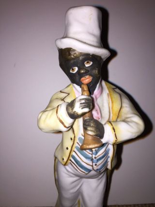 Vintage Black Americana Bisque Figure Of A Black Man Playing A Clarinet.