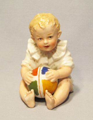 Antique Heubach Germany Hand Painted Bisque Baby Child Holding Ball Figurine