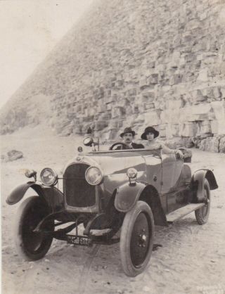 Egypt Old Vintage Photo.  Cute Couple In An Old Car With Pyramids