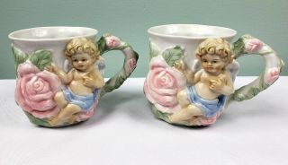 2 Avon Angel Rose Tea Cup Cherub Embossed Porcelain Mug Flowers Baby Cherub Boy