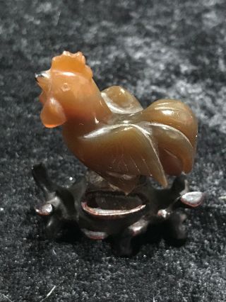 Vintage Chinese Hand Carved Amber Stone Figurine Chicken Rooster On Wood Stand.