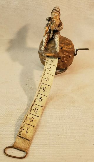 Rare Antique Cast Metal Gnome On Walnut Figural Sewing Tape Measure