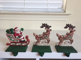 Vintage Cast Iron - 1 Santa In His Sleigh And 2 Reindeer Stocking Holders 1980s