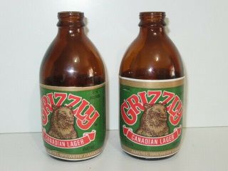 2 Grizzly Canadian Lager Beer Bottles Amstel Brewery