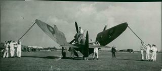 Members Of The Ground Staff Busy Unfolding The Wings Of The Fairey Firefly.  - Or
