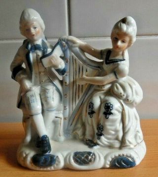 Porcelain Blue And White Lady & Man In 18th Century Dress With Harp.  14cms