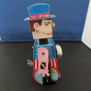 Vintage Japanese Tin Mechanical Toy: " Travelling Sam Peace Corps Man "