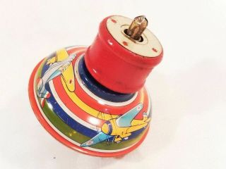 Sm Vintage Tin Litho Wind Up Top With Airplane Lithos & Red Wooden Spring Launch
