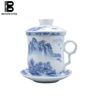 Blue And White Porcelain Tea Cup With Strainer,  Lid And Matching Saucer