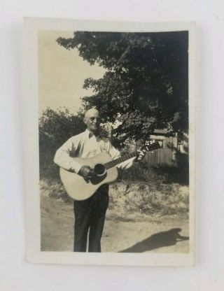 Vintage Black And White Photo.  Older Man With Guitar.