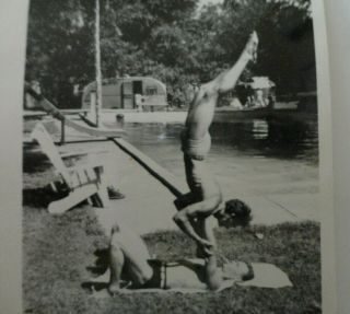 Vtg Shirtless Men Swim Trunks One Holds Other Handstand Bw Snapshot Photo 1950s