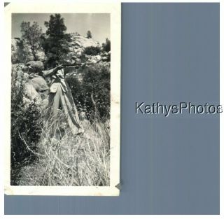 Found B&w Photo G_1281 Woman On A Rocky Slope Aiming A Rifle